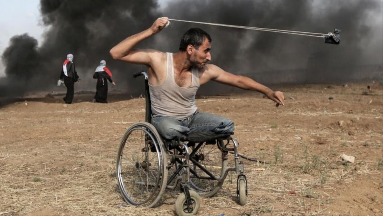 در رقابت با عکسهایی از نقاط مختلف جهان؛عکس «معلول فلسطینی در راهپیمایی بازگشت» برنده بهترین جایزه جشنواره خبرنگاران جنگ شد  2