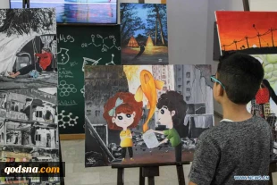 Visitors view artworks made by Palestinian children during exhibition in Gaza City
 3