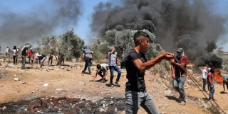 عشرات الجرحى الفلسطينيين بمواجهات مع الاحتلال في الضفة
