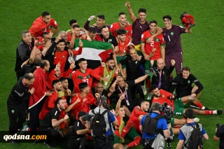 Morocco players celebrate with Palestinian flag after Spain upset