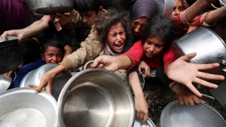 ‘Nothing but water and salt’: 

Gaza’s children face engineered famine